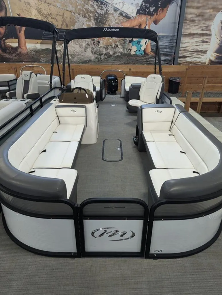 Slide: The Image of 2022 Manitou 23 Aurora LE RF VP pontoon boat with spacious seating and modern design. - 5