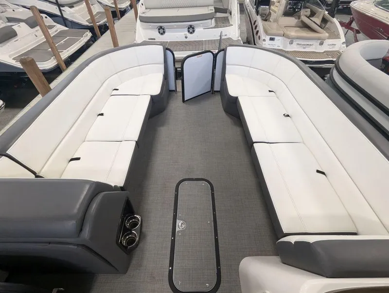 Slide: The Image of 2022 Manitou 23 Aurora LE RF VP pontoon boat interior with spacious seating. - 8