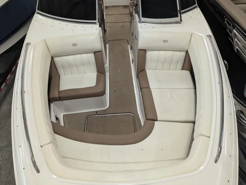 Slide: The Image of 2014 Cobalt 296 boat interior with white and brown seating. - 10
