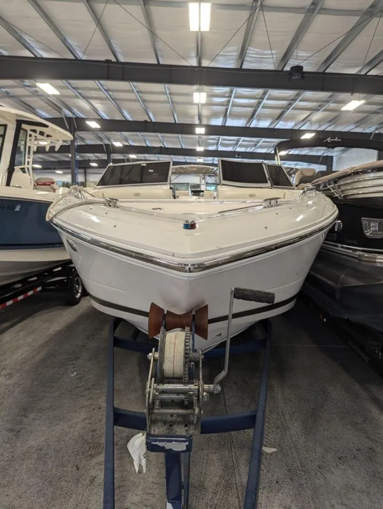 Slide: The Image of 2014 Cobalt 296 boat in indoor storage facility. - 2