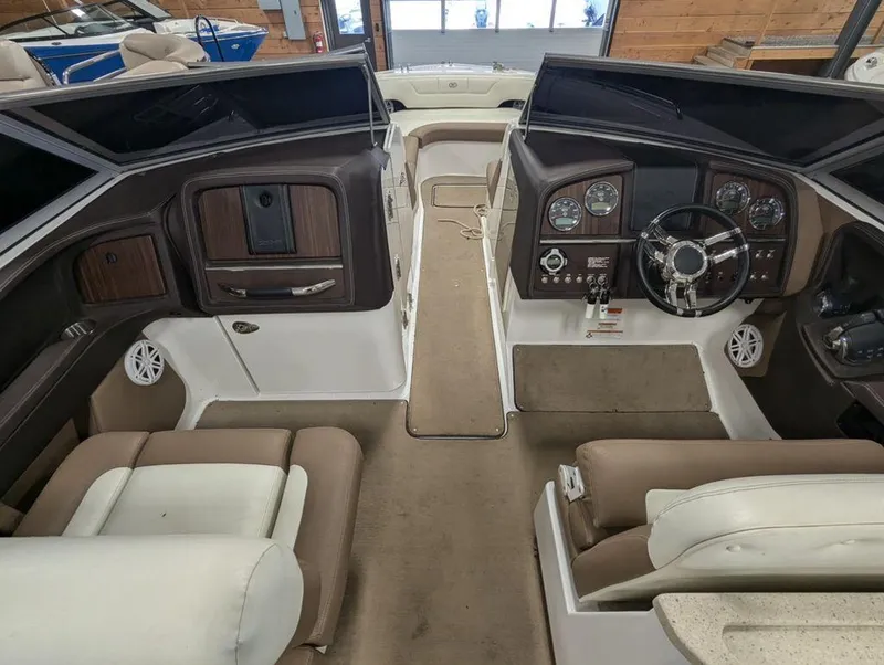 Slide: The Image of Interior of a 2014 Cobalt 296 boat, featuring a sleek dashboard and comfortable seating. - 7