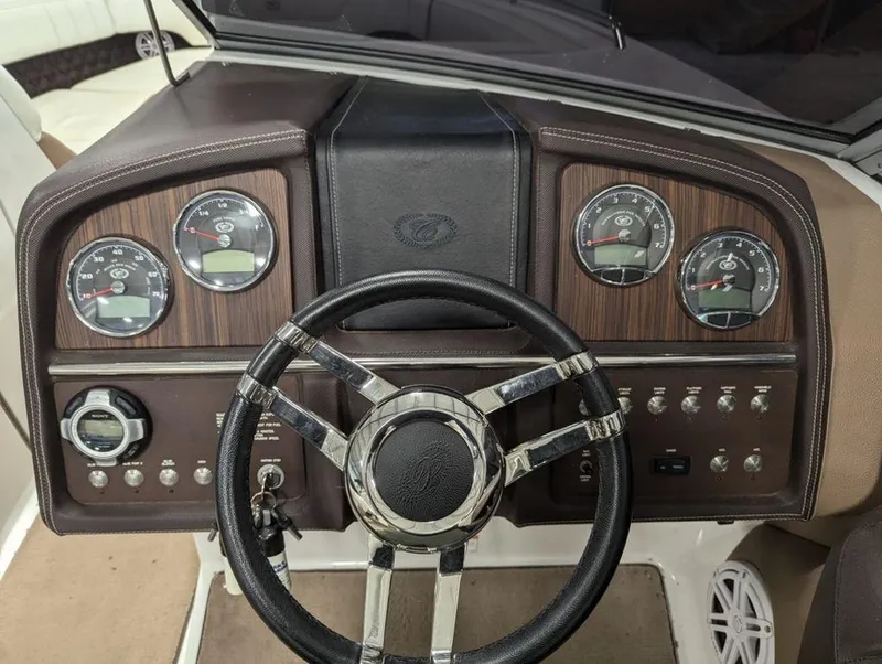Slide: The Image of Cobalt 296 boat dashboard, 2014 model, featuring gauges and steering wheel. - 8