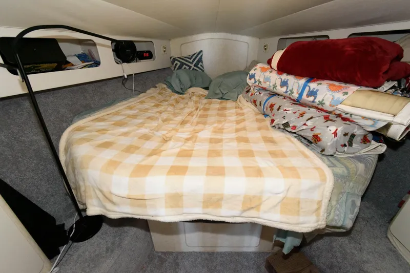 Slide: The Image of Cozy cabin interior of 1992 Silverton 34 Convertible with bed and blankets. - 17