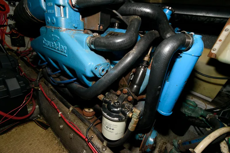 Slide: The Image of Engine compartment of a 1992 Silverton 34 Convertible boat, featuring a Crusader engine. - 21