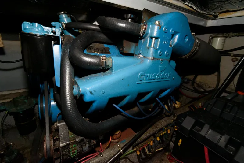 Slide: The Image of Engine compartment of a 1992 Silverton 34 Convertible boat, featuring a Crusader engine. - 22