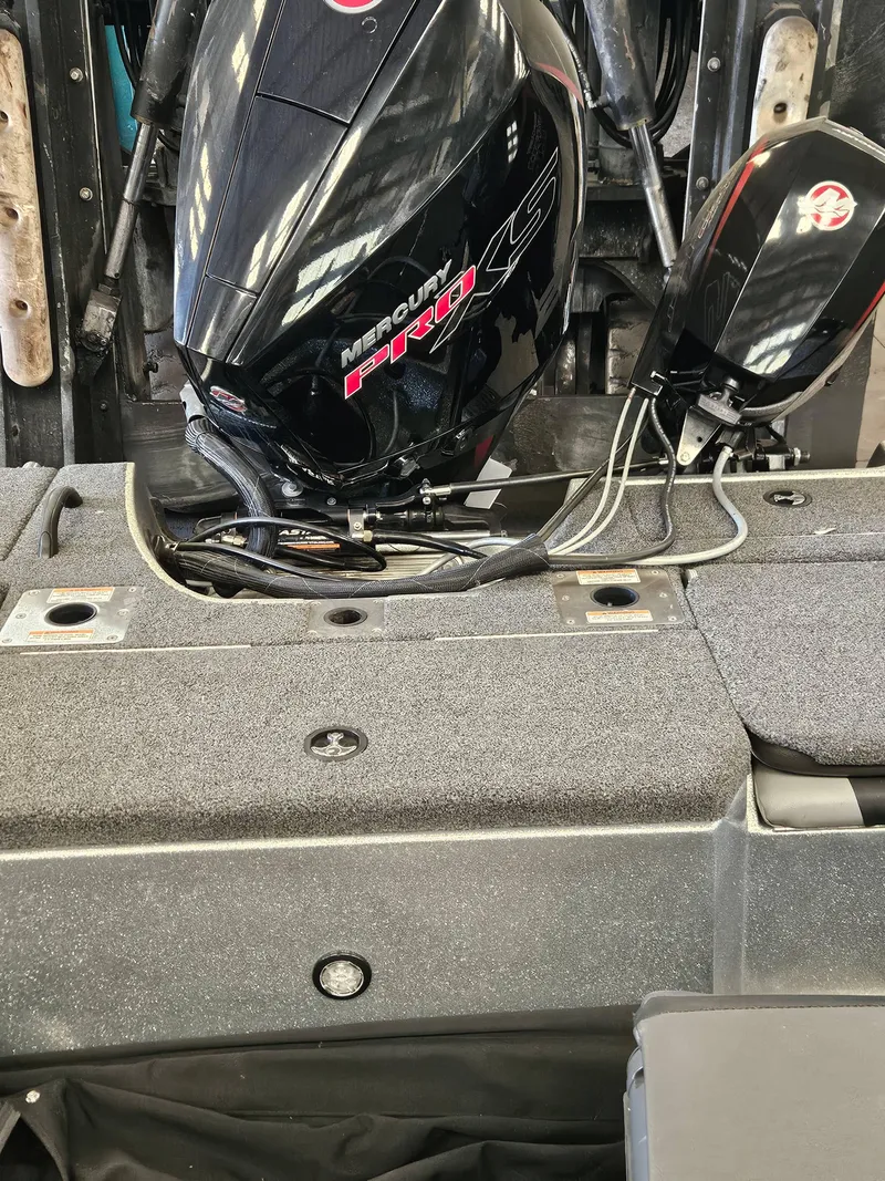 Slide: The Image of 2022 Lund TYEE boat with Mercury Pro XS engine, detailed view of motor and deck. - 13