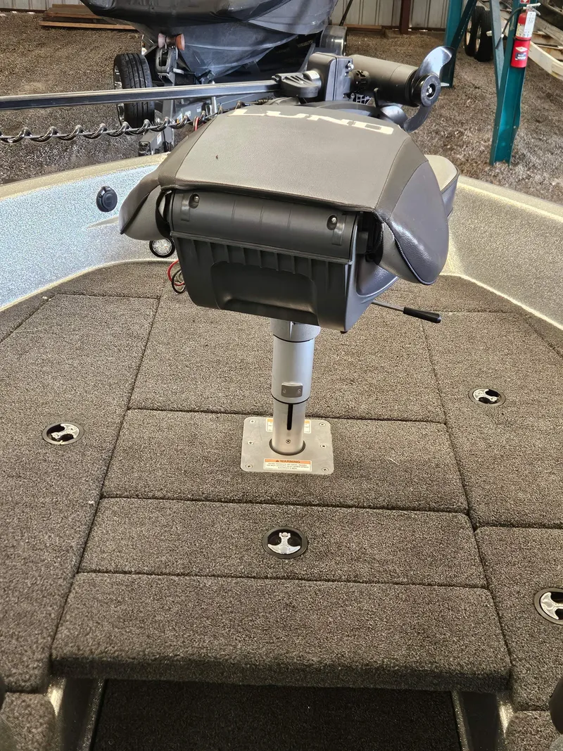 Slide: The Image of 2022 Lund TYEE boat interior with mounted equipment and carpeted deck. - 14