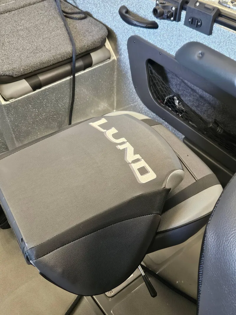 Slide: The Image of 2022 Lund TYEE boat seat with logo, black and gray upholstery. - 15