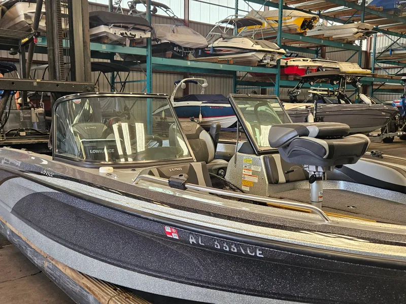 Slide: The Image of 2022 Lund TYEE boat in storage facility with other boats. - 3