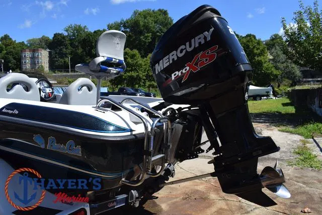 Slide: The Image of 2012 Bass Cat Pantera IV boat with Mercury Pro XS engine, outdoors at Thayer's Marine. - 12