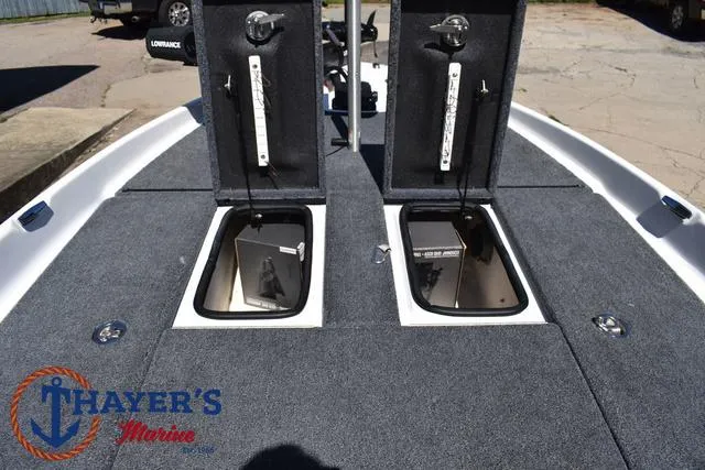 Slide: The Image of 2012 Bass Cat Pantera IV boat deck with open storage compartments. - 19