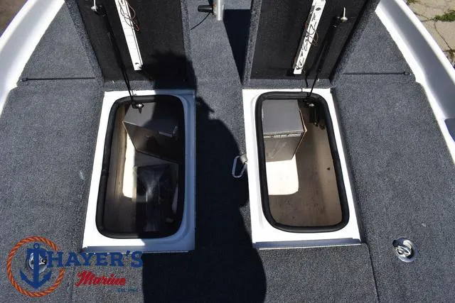Slide: The Image of 2012 Bass Cat Pantera IV boat storage compartments, Thayer's Marine logo visible. - 20