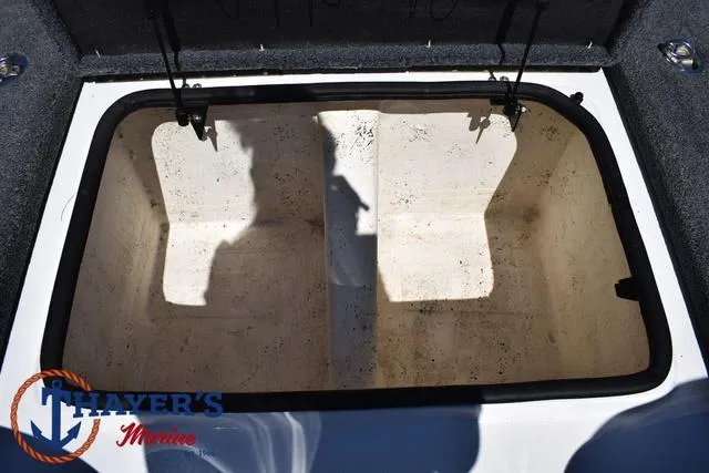 Slide: The Image of 2012 Bass Cat Pantera IV storage compartment, open lid, spacious interior, Thayer's Marine logo. - 22