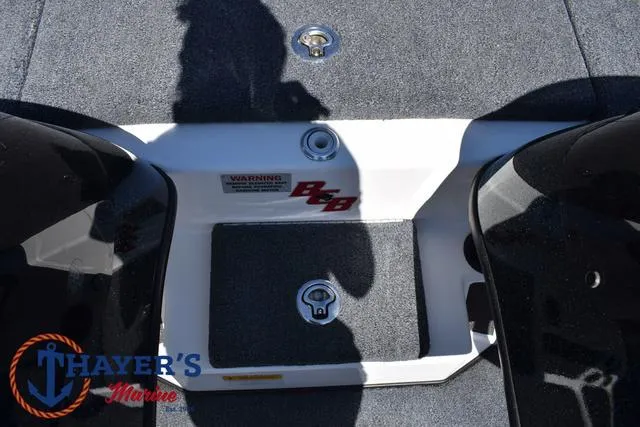Slide: The Image of 2012 Bass Cat Pantera IV boat deck with storage compartments and Thayer's Marine logo. - 23