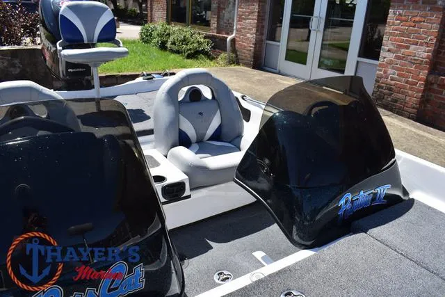 Slide: The Image of 2012 Bass Cat Pantera IV boat interior with dual consoles and seating. - 26