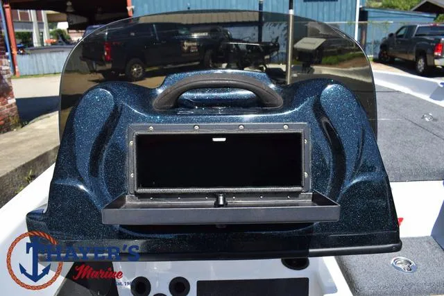 Slide: The Image of 2012 Bass Cat Pantera IV boat dashboard with open storage compartment. - 30