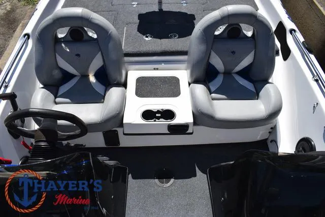 Slide: The Image of 2012 Bass Cat Pantera IV boat interior with dual seats and steering wheel. - 32