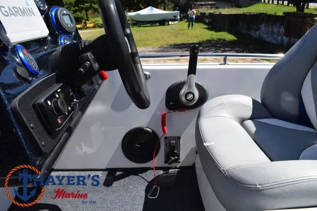 Slide: The Image of 2012 Bass Cat Pantera IV boat interior with steering wheel and seat. - 37