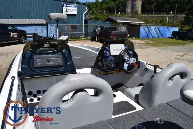 Slide: The Image of 2012 Bass Cat Pantera IV boat interior with steering console and seating at Thayer's Marine. - 45