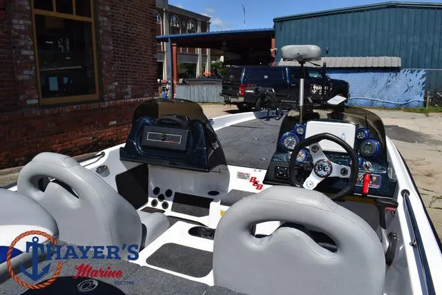 Slide: The Image of 2012 Bass Cat Pantera IV boat interior with steering wheel and dashboard controls. - 47