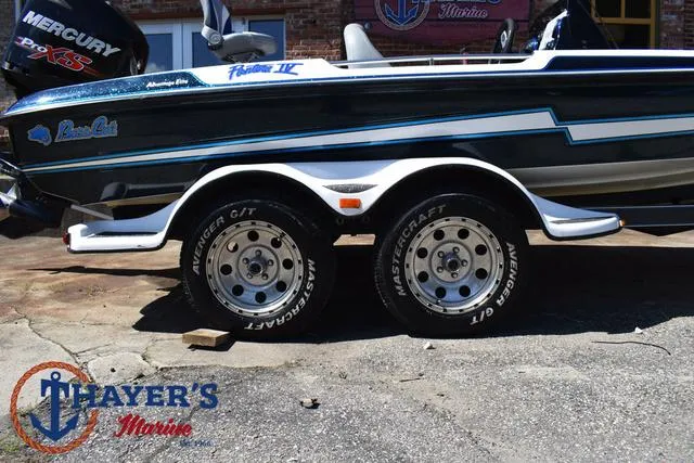 Slide: The Image of 2012 Bass Cat Pantera IV boat on trailer at Thayer's Marine. - 6
