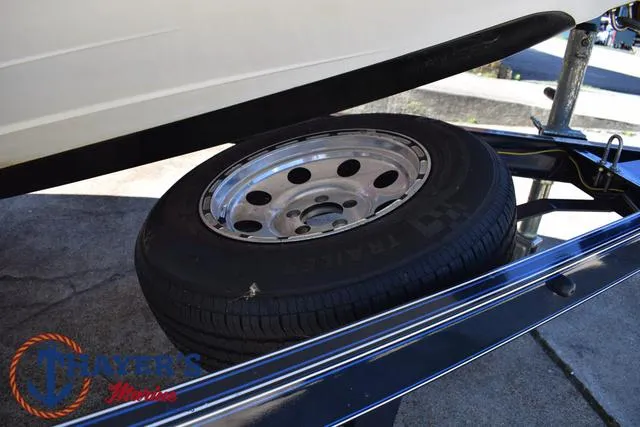 Slide: The Image of 2012 Bass Cat Pantera IV trailer tire on pavement. - 7