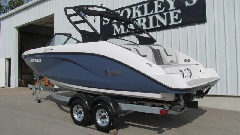 Slide: The Image of 2025 Yamaha AR220 boat on trailer at Stokley's Marine dealership. - 2
