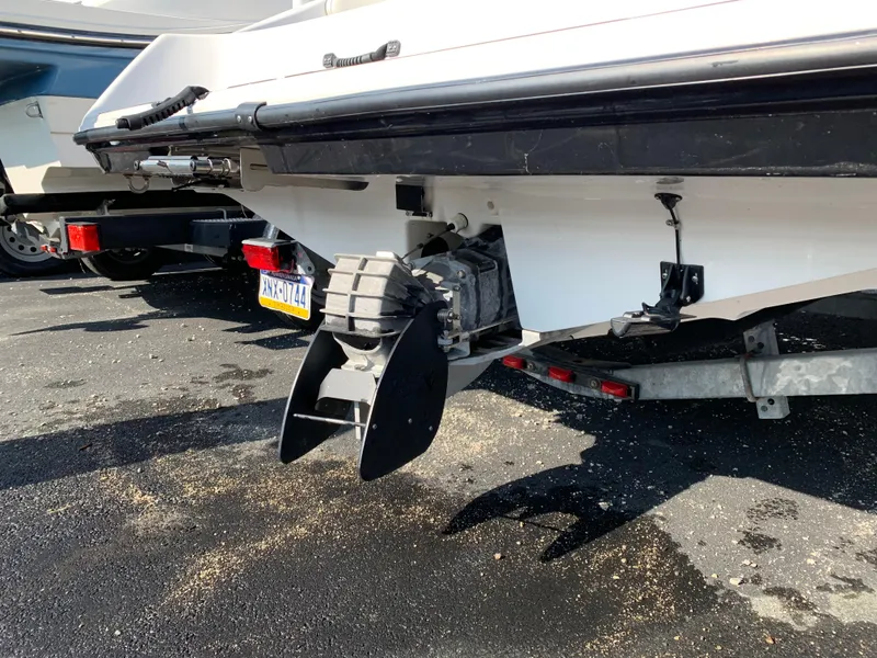 Slide: The Image of 2016 Yamaha Boats 190 SX rear view, showcasing the boat's propeller and trailer. - 9
