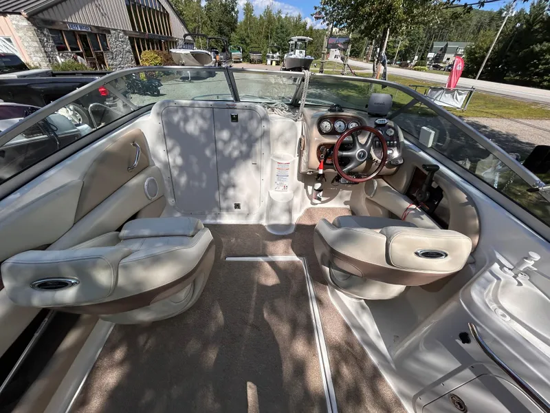 Slide: The Image of 2005 Chaparral 215 SSi boat interior with steering wheel and seating. - 11