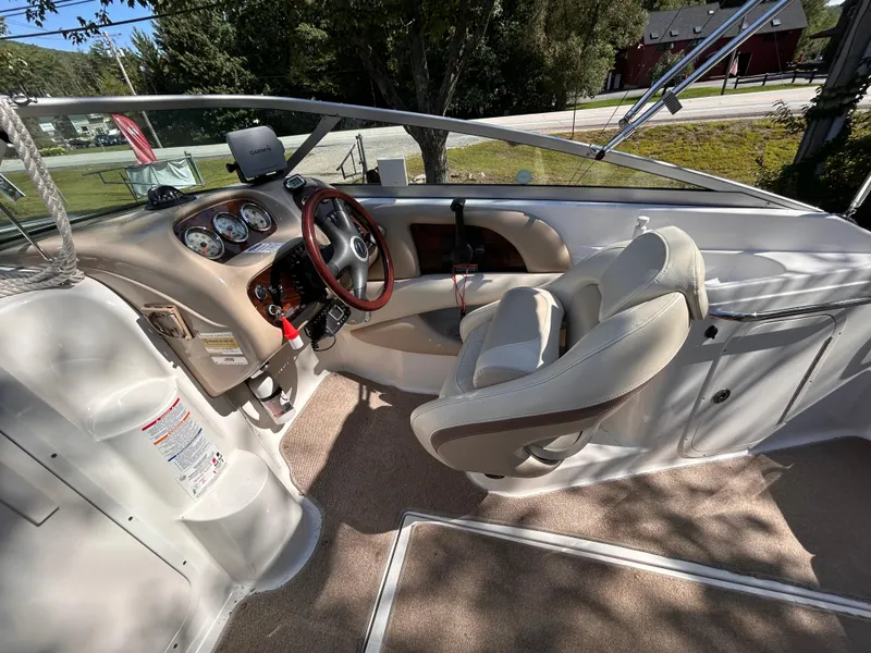 Slide: The Image of 2005 Chaparral 215 SSi boat interior with steering wheel and dashboard. - 12
