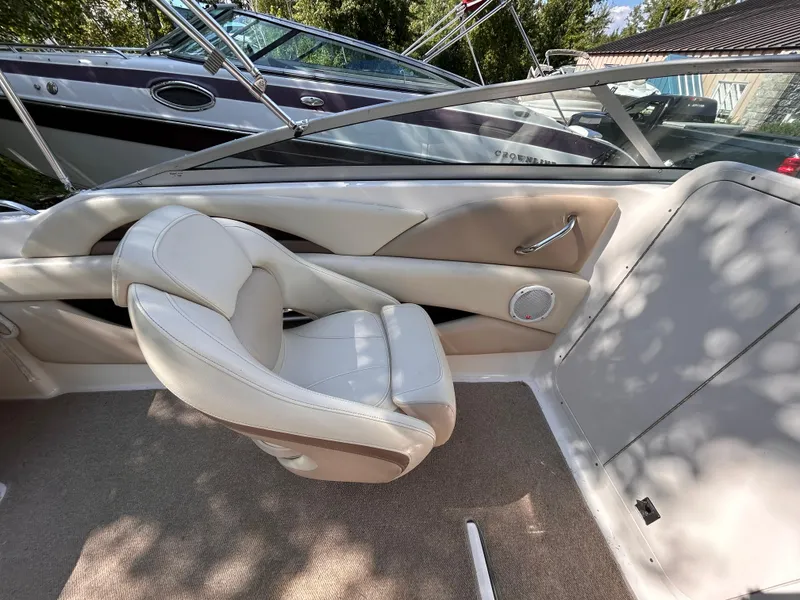 Slide: The Image of Interior of 2005 Chaparral 215 SSi boat with beige seating and carpet. - 18