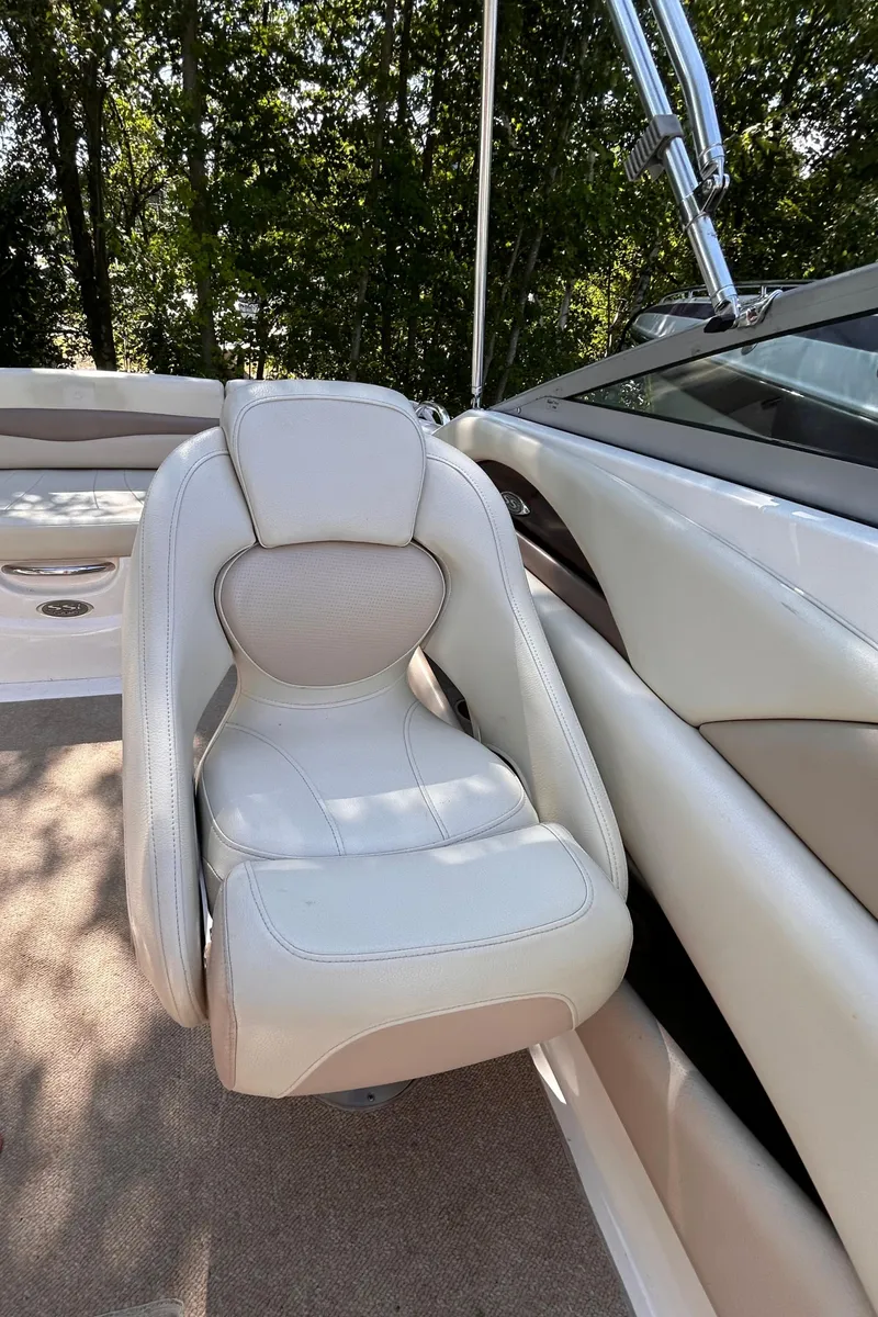 Slide: The Image of 2005 Chaparral 215 SSi boat interior with white leather seat and sleek design. - 19