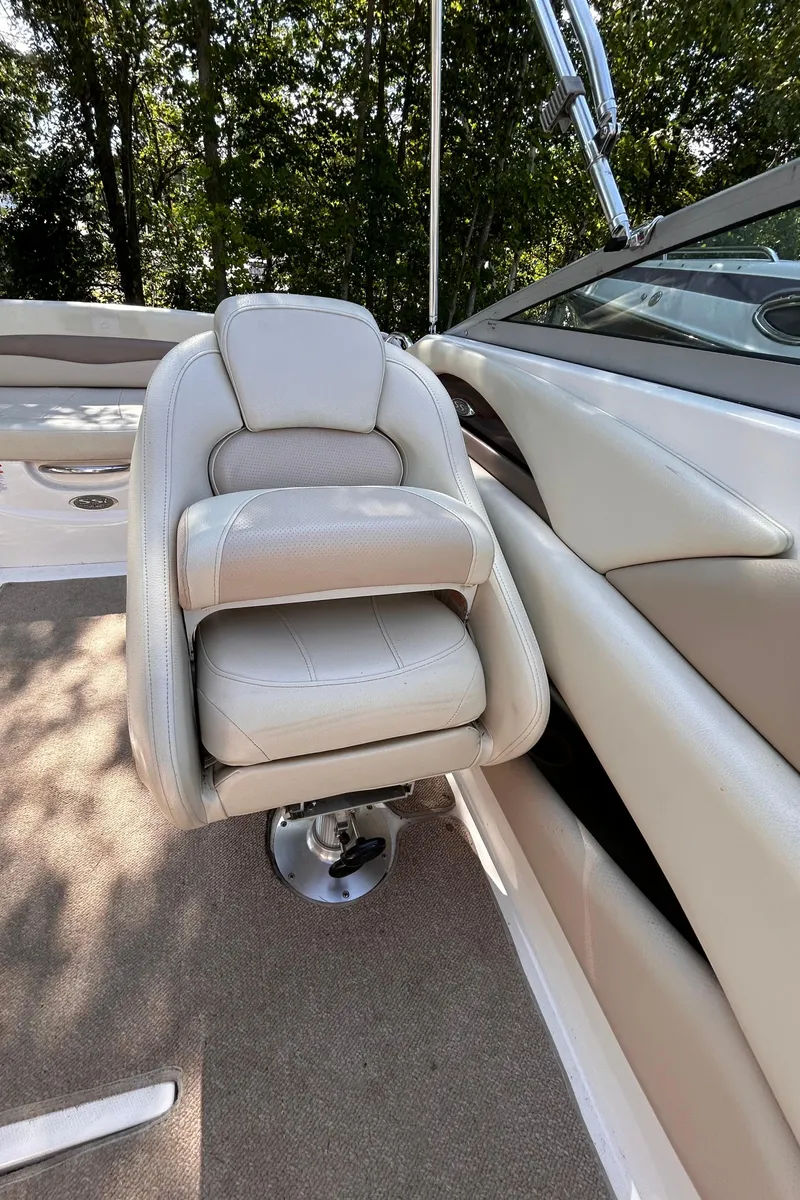 Slide: The Image of 2005 Chaparral 215 SSi boat interior with beige seating and carpet. - 20