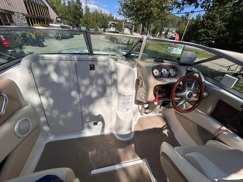 Slide: The Image of Interior of 2005 Chaparral 215 SSi boat with steering wheel and dashboard controls. - 21