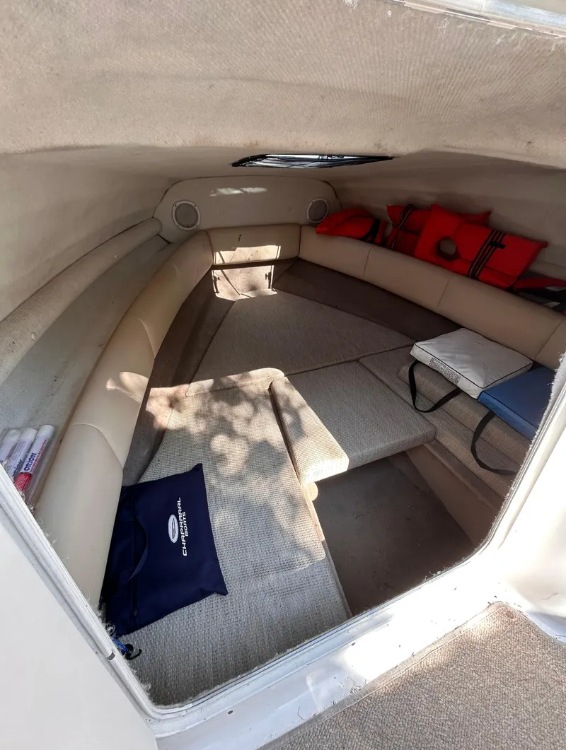 Slide: The Image of 2005 Chaparral 215 SSi boat cabin interior with seating and life jackets. - 23