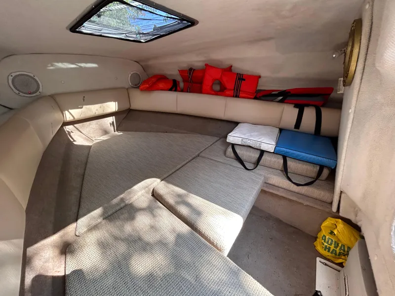 Slide: The Image of Interior cabin of 2005 Chaparral 215 SSi boat with seating and life jackets. - 25