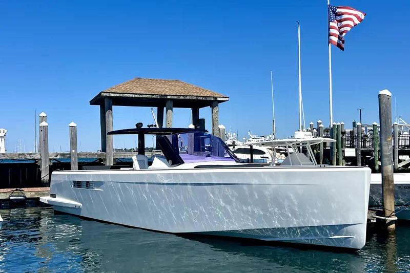 The Image of 2012 Fjord 40 Open yacht docked at marina with American flag. - 0
