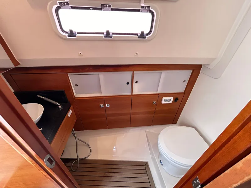 Slide: The Image of Luxurious bathroom in 2012 Fjord 40 Open yacht with wooden cabinetry and modern fixtures. - 11