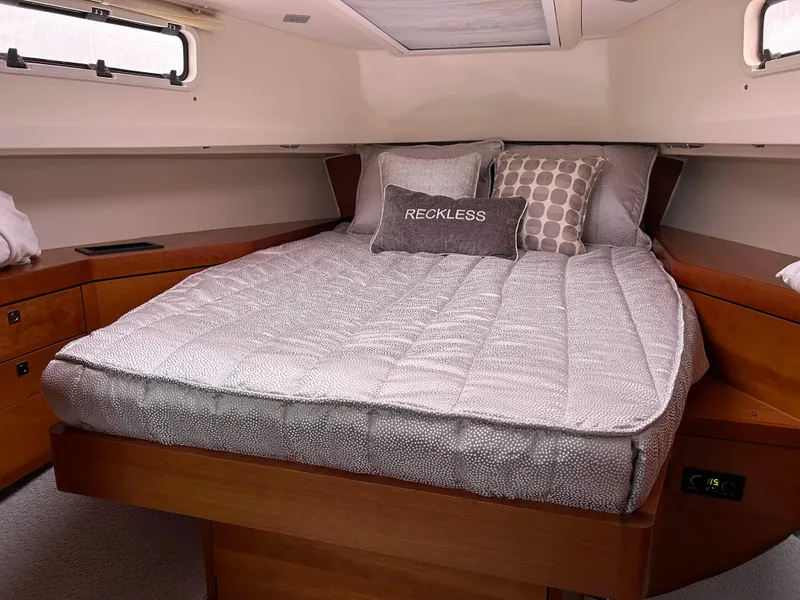 Slide: The Image of Cozy cabin interior of 2012 Fjord 40 Open yacht with comfortable bedding. - 8