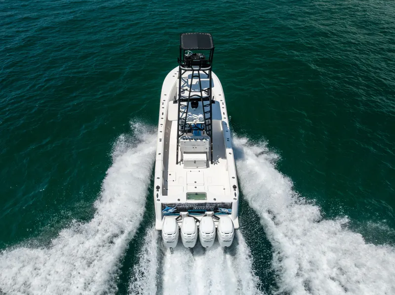 Slide: The Image of 2008 SeaVee 390 B boat cruising on open water, aerial view. - 11