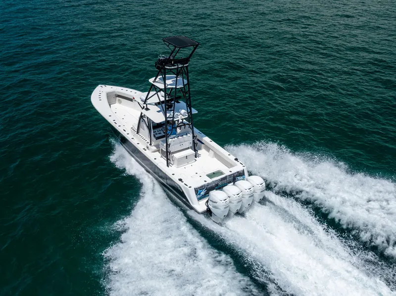 Slide: The Image of 2008 SeaVee 390 B boat cruising on open water, aerial view. - 12