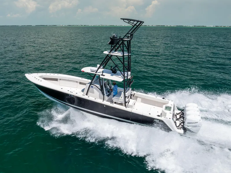 Slide: The Image of 2008 SeaVee 390 B boat cruising on open water. - 13
