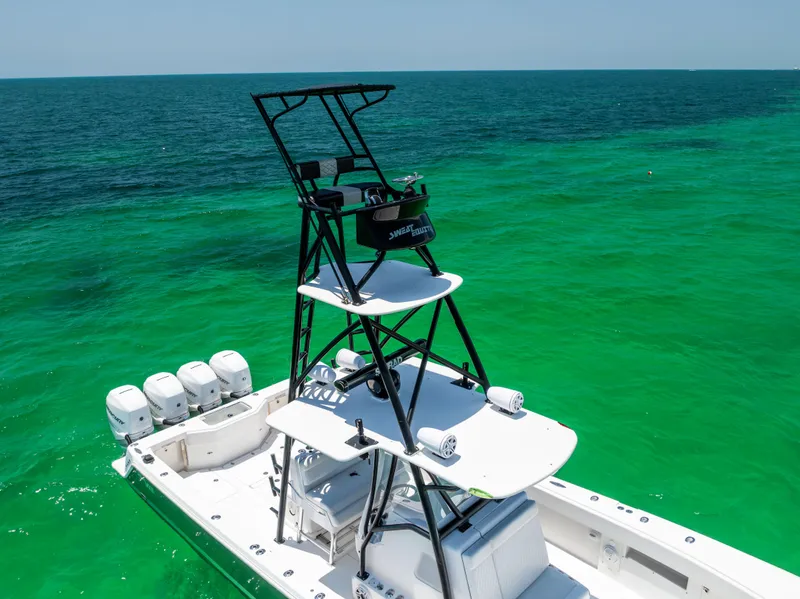 Slide: The Image of 2008 SeaVee 390 B boat with tower on turquoise ocean. - 16