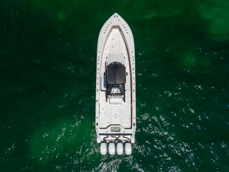 Slide: The Image of Aerial view of 2008 SeaVee 390 B boat on green water. - 18