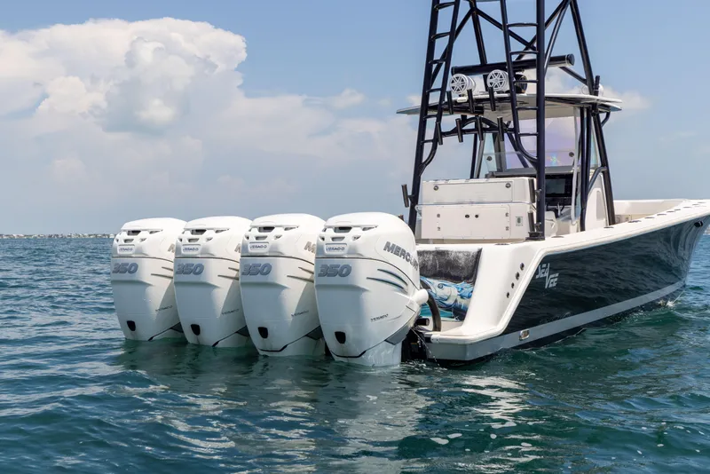 Slide: The Image of 2008 SeaVee 390 B boat with four powerful outboard engines on the water. - 19