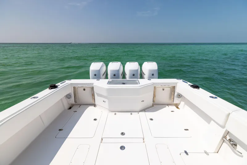 Slide: The Image of 2008 SeaVee 390 B boat deck with quad engines on open sea. - 27