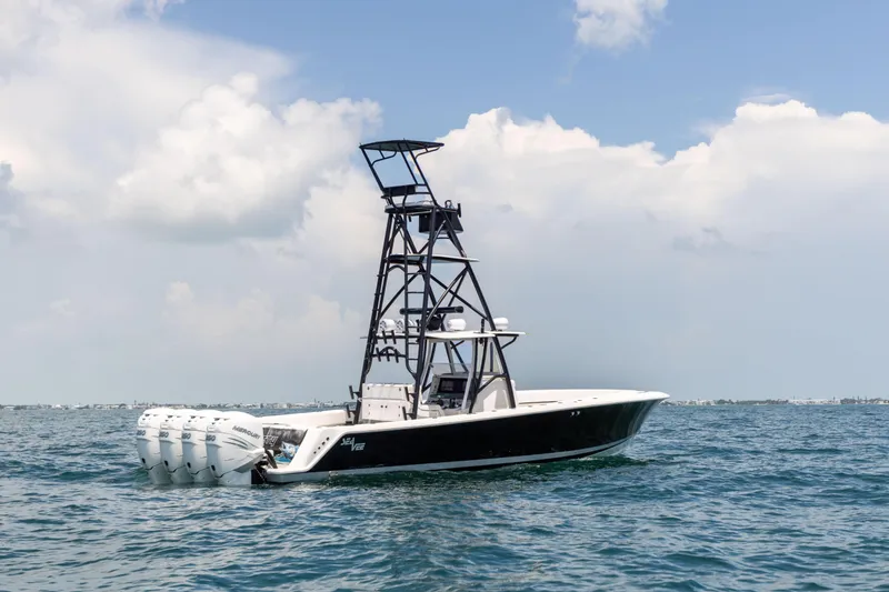 Slide: The Image of 2008 SeaVee 390 B boat with tower and multiple engines on open water. - 3