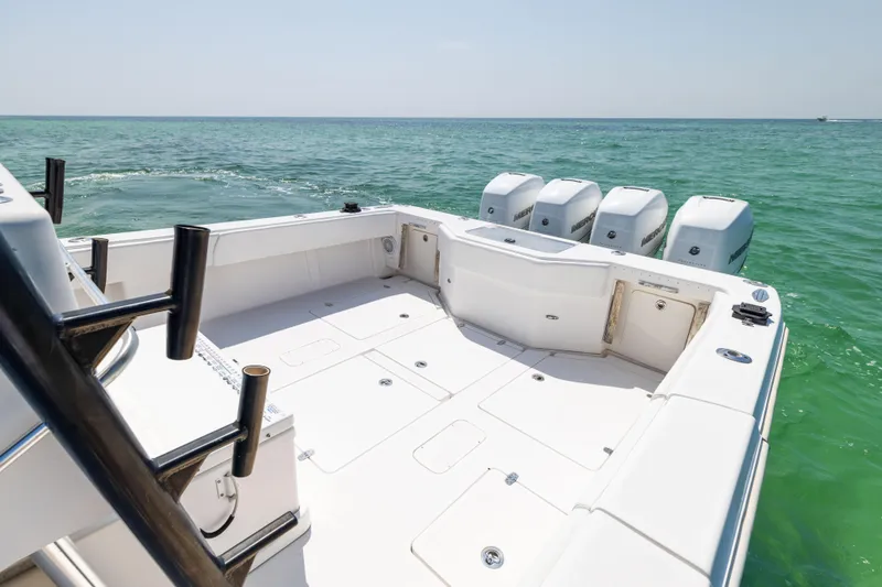 Slide: The Image of 2008 SeaVee 390 B boat with quad engines on turquoise water. - 30