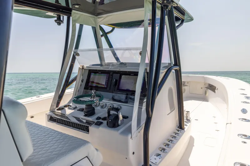 Slide: The Image of 2008 SeaVee 390 B boat cockpit with modern navigation equipment and ocean view. - 37