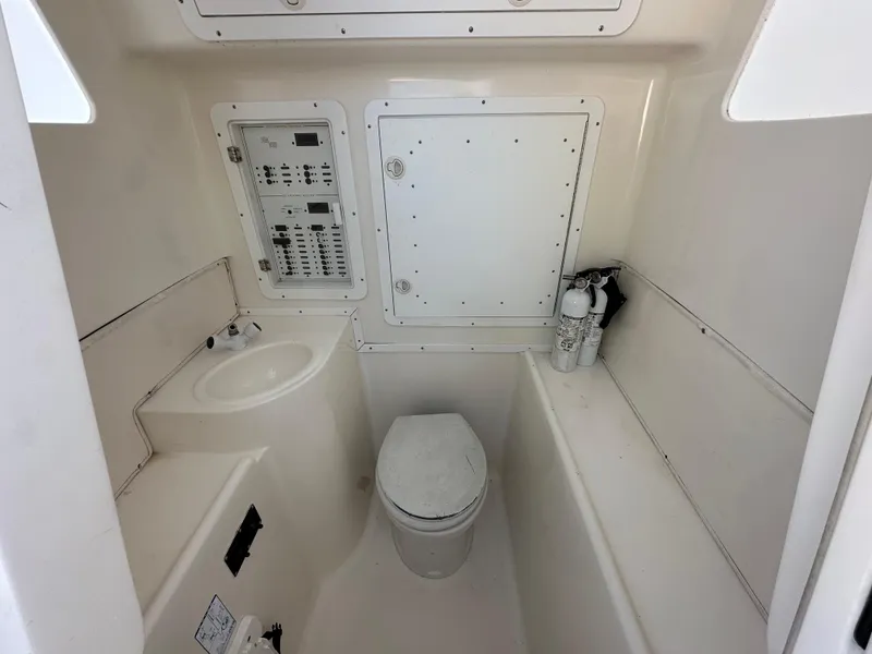 Slide: The Image of 2008 SeaVee 390 B boat bathroom with toilet, sink, and control panel. - 39